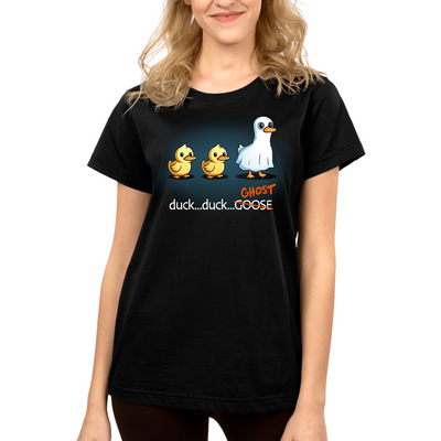 Premium Cotton T-shirt_TeeTurtle black Duck...Duck...Ghost Premium Cotton T-shirt featuring two normal ducks followed by a third duck dressed as a ghost in a white sheet, creating a playful twist on the classic "Duck, Duck, Goose" game.
