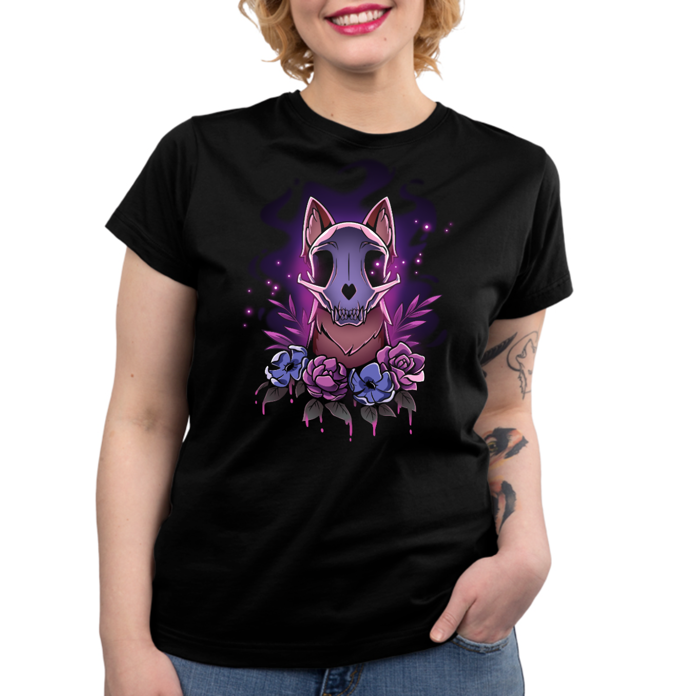 Premium Cotton T-shirt_TeeTurtle black Memento Vulpes Premium Cotton T-shirt featuring a fox skull resting on a weathered log with four purple flowers below, illuminated by a mystical purple glow.