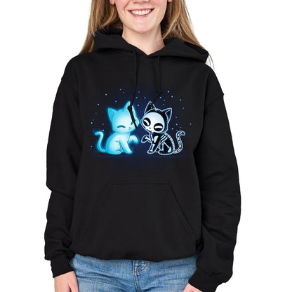 Pullover Hoodie_TeeTurtle black Purranormal Pals Pullover Hoodie featuring a glowing blue ghost cat sitting beside a smiling skeleton cat, surrounded by small blue stars.
