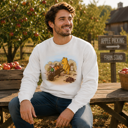 Crew Neck Sweatshirt_TeeTurtle white A Perfect Autumn Day Crew Neck Sweatshirt featuring a bear pulling a wagon filled with pumpkins while a little mouse rides along, surrounded by autumn bushes, fallen leaves, and tree stumps on a crisp fall day.