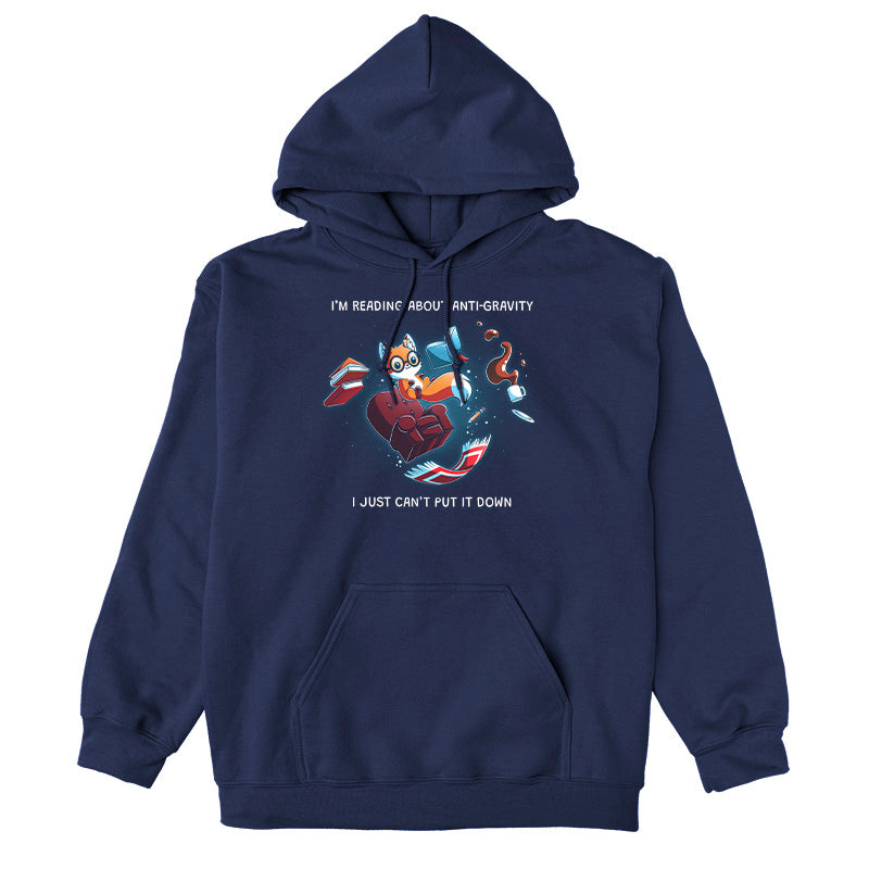 Pullover Hoodie_TeeTurtle navy blue Anti-Gravity Enthusiast apparel featuring a fox wearing glasses reading a book with floating in mid-air with its living room furniture, such as a chair, rug, and lamp, with the caption, “I’m Reading About Anti-Gravity, I Just Can’t Put It Down“.