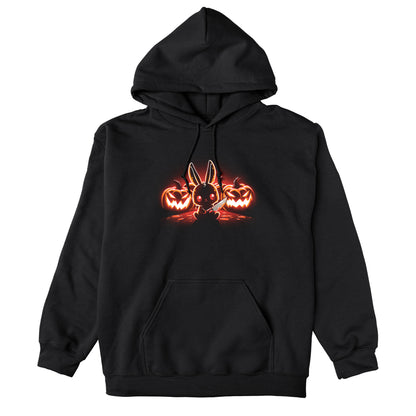 Pullover Hoodie_TeeTurtle Pumpkin Murderer black design featuring a cute bunny holding a knife sitting in front of carved jack-o'-lanterns, illuminated by a glowing red light.