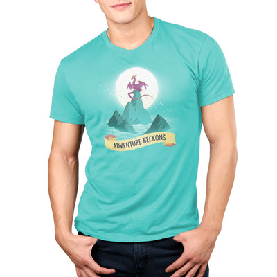 Premium Cotton T-shirt_Teeturtle Adventure Beckons Caribbean Blue apparel featuring a dragon perched on a mountain peak set above the clouds with the sun behind it and the words 'Adventure Beckons' beneath.