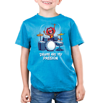 A boy wearing an officially licensed Muppets t-shirt with the product name "Animal: Drums Are My Passion".