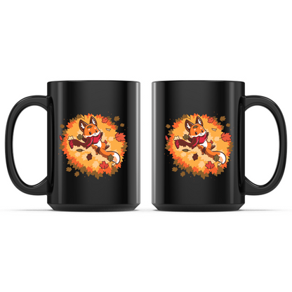 Ceramic Mug_TeeTurtle Autumn Fox black mug featuring a smiling fox wearing a cozy scarf while relaxing in a pile of colorful autumn leaves with leaves gently falling all around.