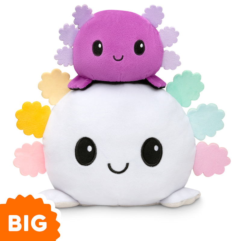A TeeTurtle Big Reversible Axolotl Plushie (Rainbow Gills) in purple and pink, with the word "big" on it.