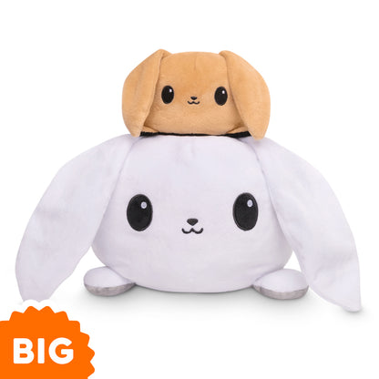 A TeeTurtle Big Reversible Bunny Plushie (White + Gray) is stacked on top of another bunny.