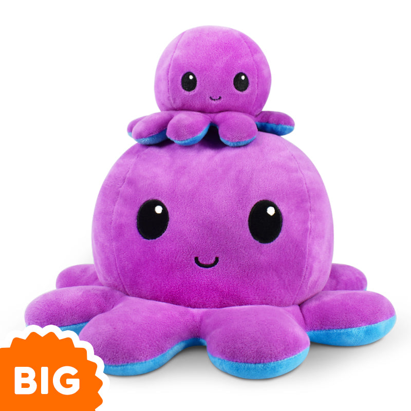 A TeeTurtle Big Reversible Octopus Plushie (Purple + Blue) from TeeTurtle is stacked on top of another octopus.