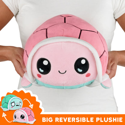Get your hands on the TeeTurtle Big Reversible Turtle Plushie (Aqua + Pink) from teeTurtle. This mood plushie is a must-have for any collector.