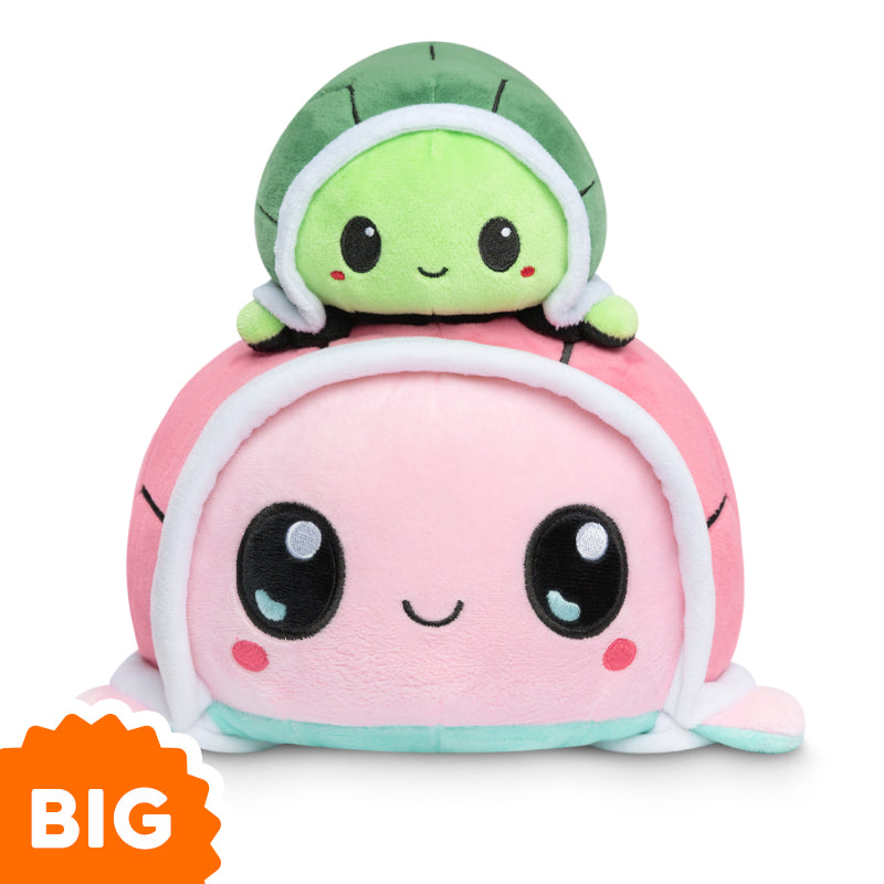 Two TeeTurtle Big Reversible Turtle Plushies (Aqua + Pink) stacked on top of each other.