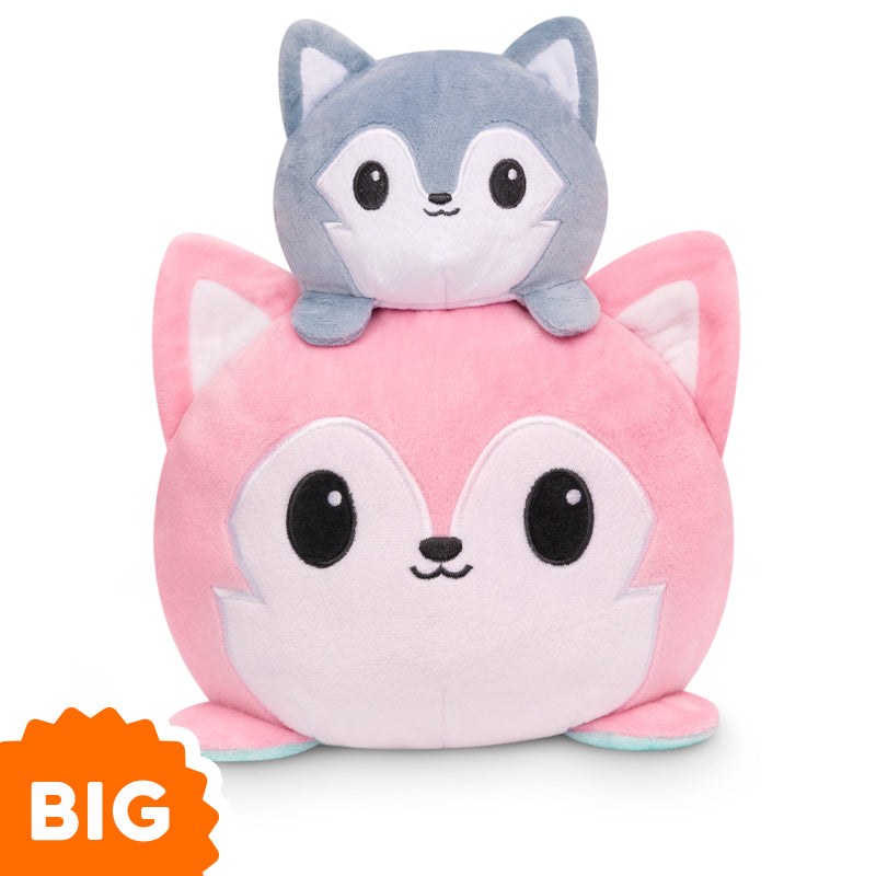 Two TeeTurtle Big Reversible Wolf Plushies (Pink + Aqua) stacked on top of each other, perfect as mood plushies.