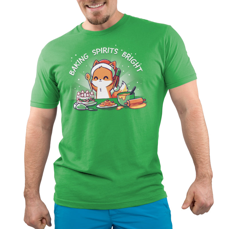 Premium Cotton T-shirt - A person is wearing an apple green apparel with a cartoon fox baking and the text "Baking Spirits Bright." They are smiling in their super soft ringspun cotton tee, paired with blue shorts. The apparel is called 'Baking Spirits Bright' by monsterdigital.