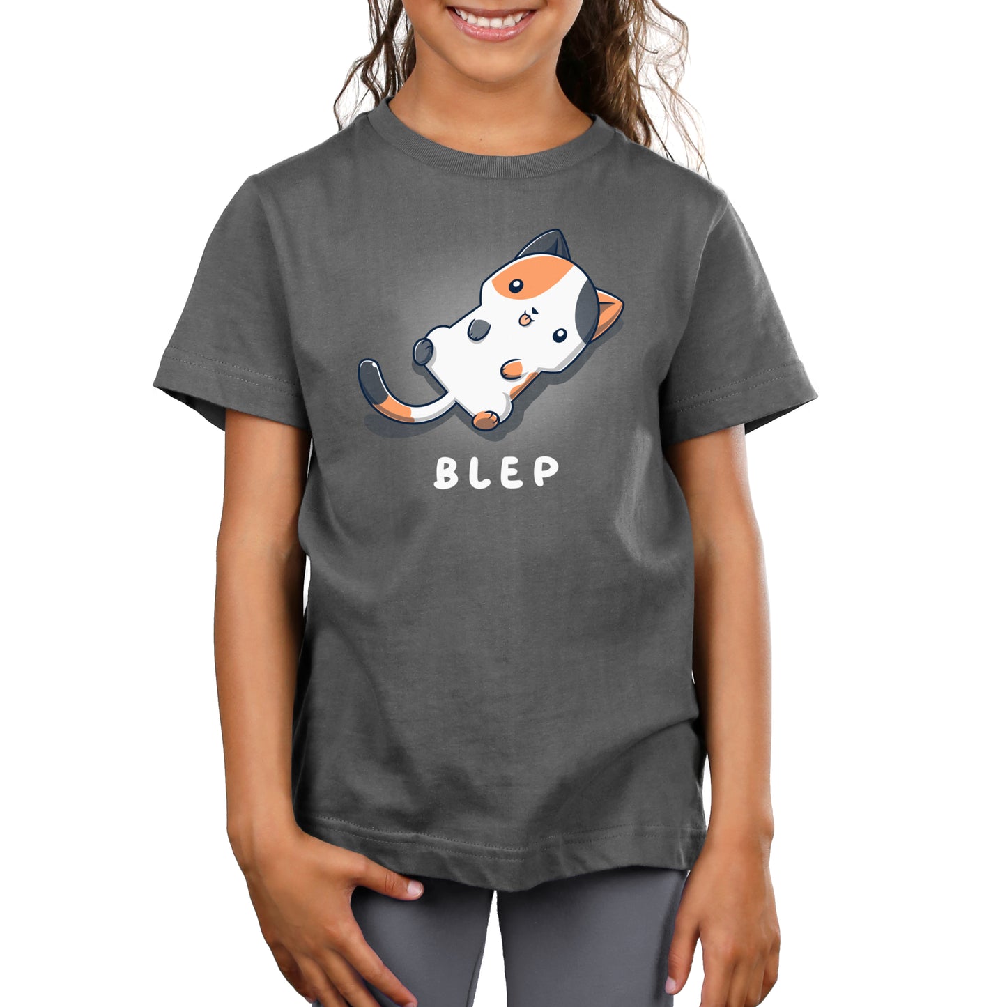 A girl wearing a charcoal gray t-shirt that says Blep Kitty by TeeTurtle.