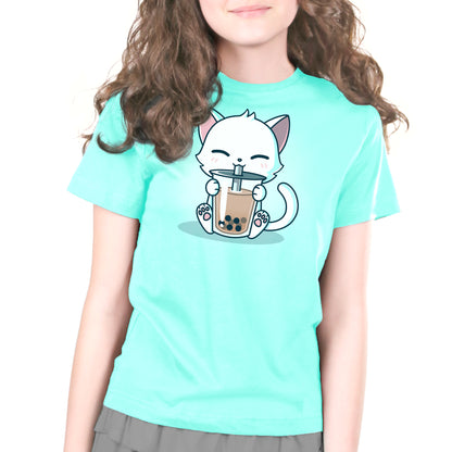 A girl wearing a "Boba Cat" t-shirt by TeeTurtle with a cartoon cat holding a cup of boba.