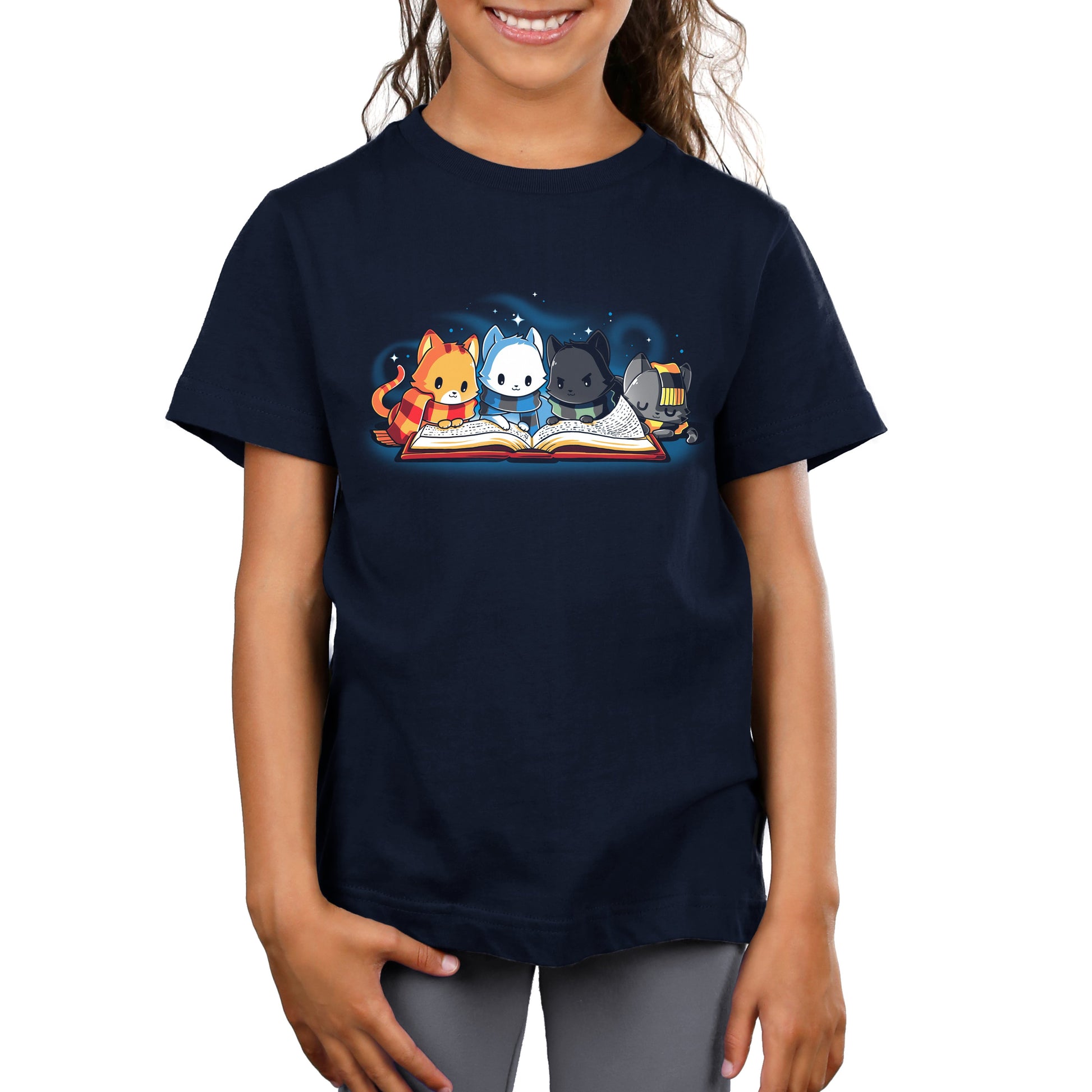 A girl wearing a TeeTurtle t-shirt with cats on it.