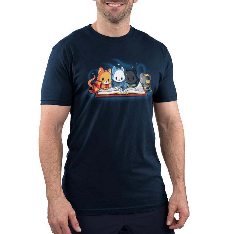 A man wearing a Books Are Magic T-shirt with cats on it. (Brand: TeeTurtle)