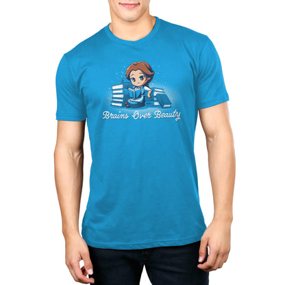 A man wearing an Officially Licensed Disney "Brains Over Beauty" blue t-shirt.