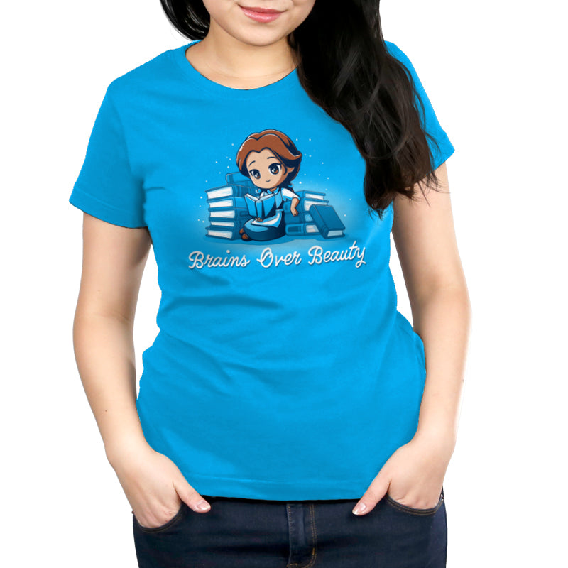 A Disney Belle-inspired "Brains Over Beauty" blue women's T-shirt featuring a girl holding a book, officially licensed.