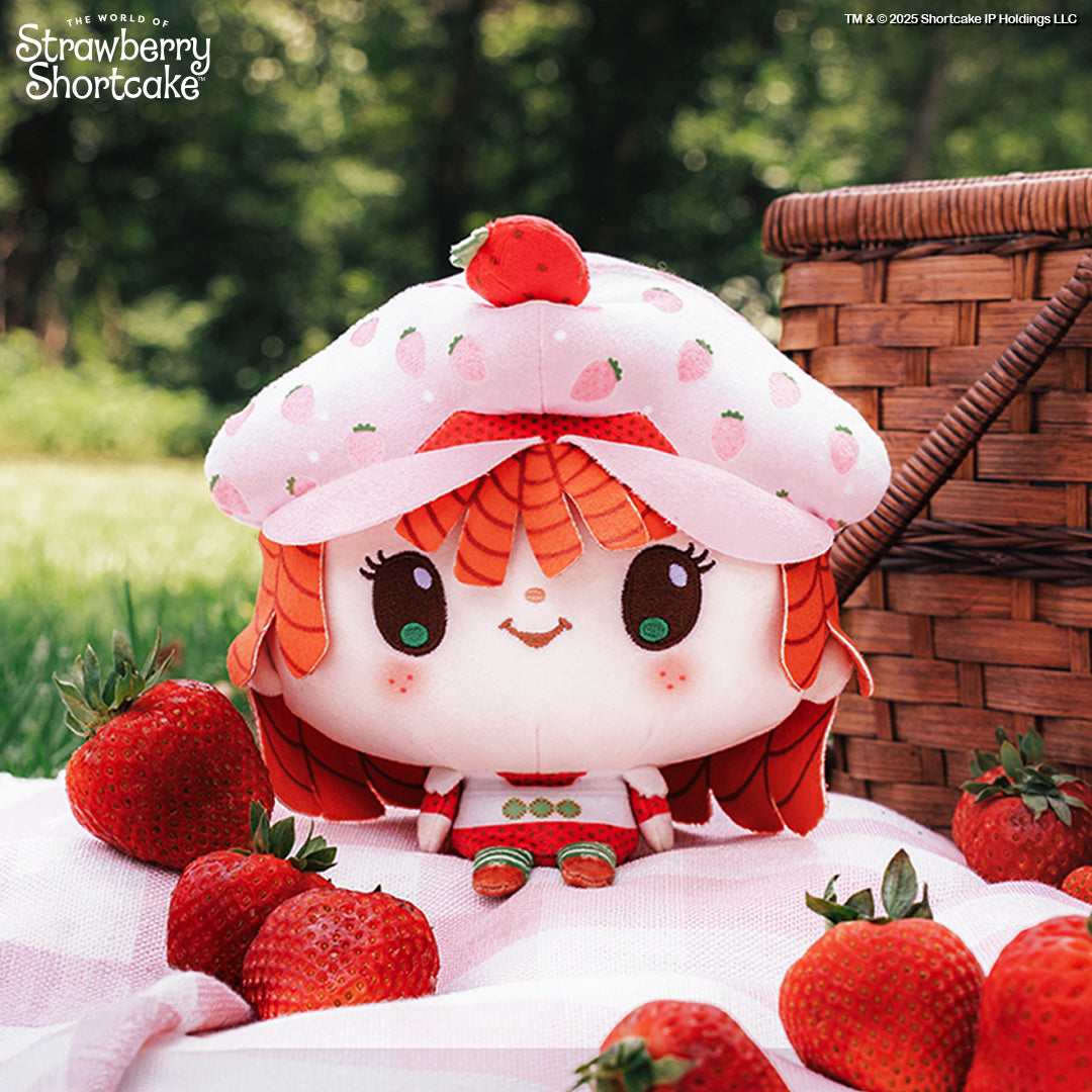 Cloudheads: 5" Strawberry-Scented Strawberry Shortcake sitting on a pink picnic blanket surrounded by strawberries and a picnic basket