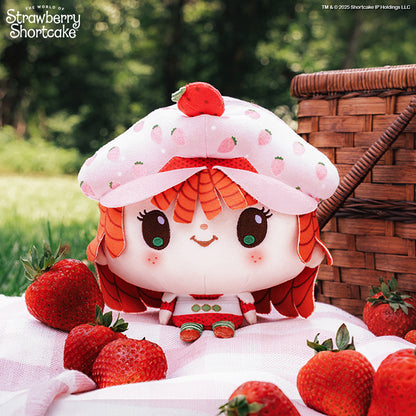 Cloudheads: 5" Strawberry-Scented Strawberry Shortcake sitting on a pink picnic blanket surrounded by strawberries and a picnic basket