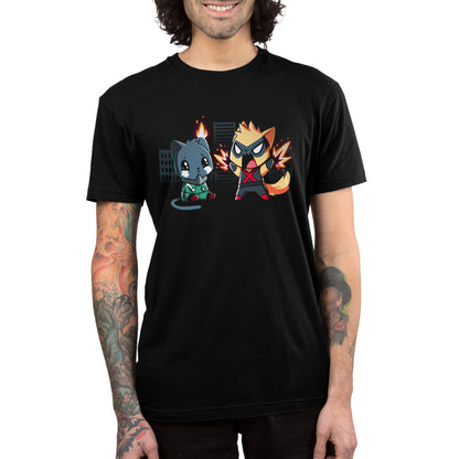Person wearing a monsterdigital original black unisex tee featuring a cartoon graphic of two chibi-style superhero animals, with one in a green suit and the other in a red and black suit, against a cityscape background.