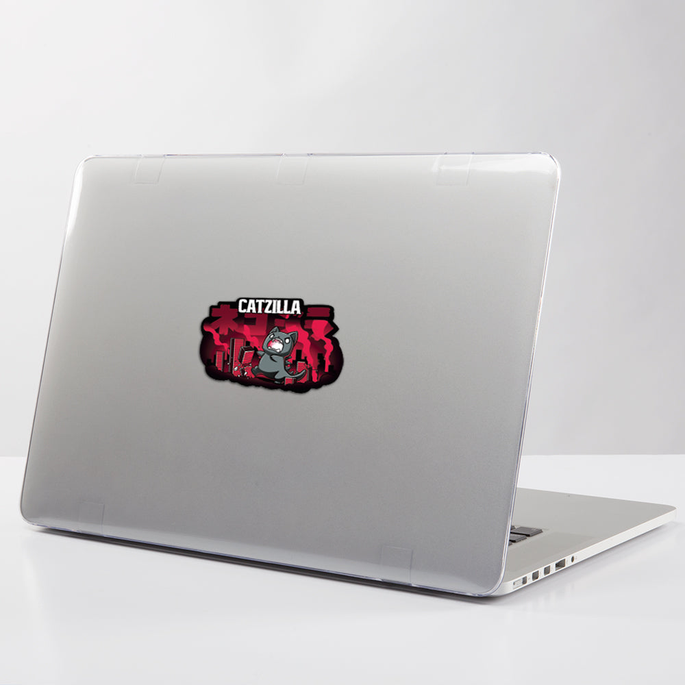 A laptop with a TeeTurtle Catzilla Sticker on it covered in water-resistant vinyl stickers.