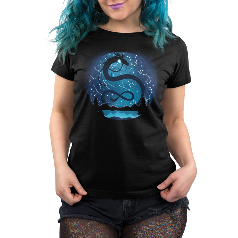 A woman wearing a black t-shirt with a Celestial Dragon (Glow) on it, exuding mystery and beauty from TeeTurtle.