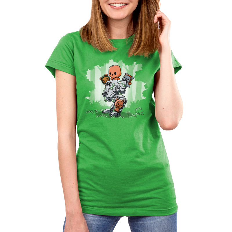 A woman wearing a green unisex tee with an image of an elephant and Chewbacca and Ewoks from Star Wars' Chewie's Playground.