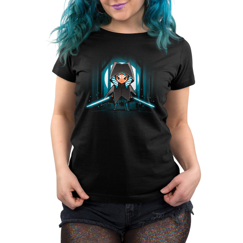 An officially licensed black women's t-shirt featuring an image of Cloaked Ahsoka Tano, a Star Wars character wielding lightsabers.