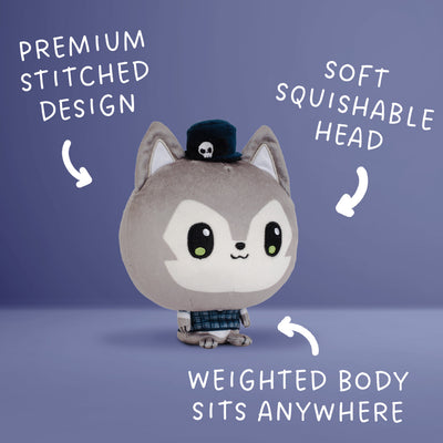 A plush toy character with a gray and wolf, large black eyes, a small black hat with a skull, and a plaid outfit, shown on a blue gradient background with white text callouts describing features.
