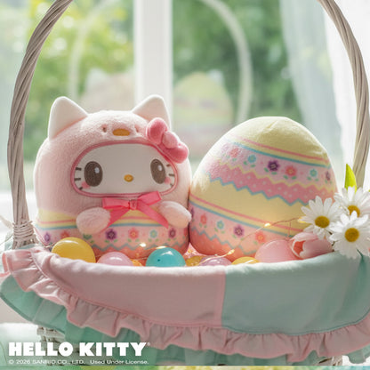 Easter Egg Hello Kitty 4" Reversible Plushie in an Easter basket with flowers, and Easter eggs sitting on a windowsill