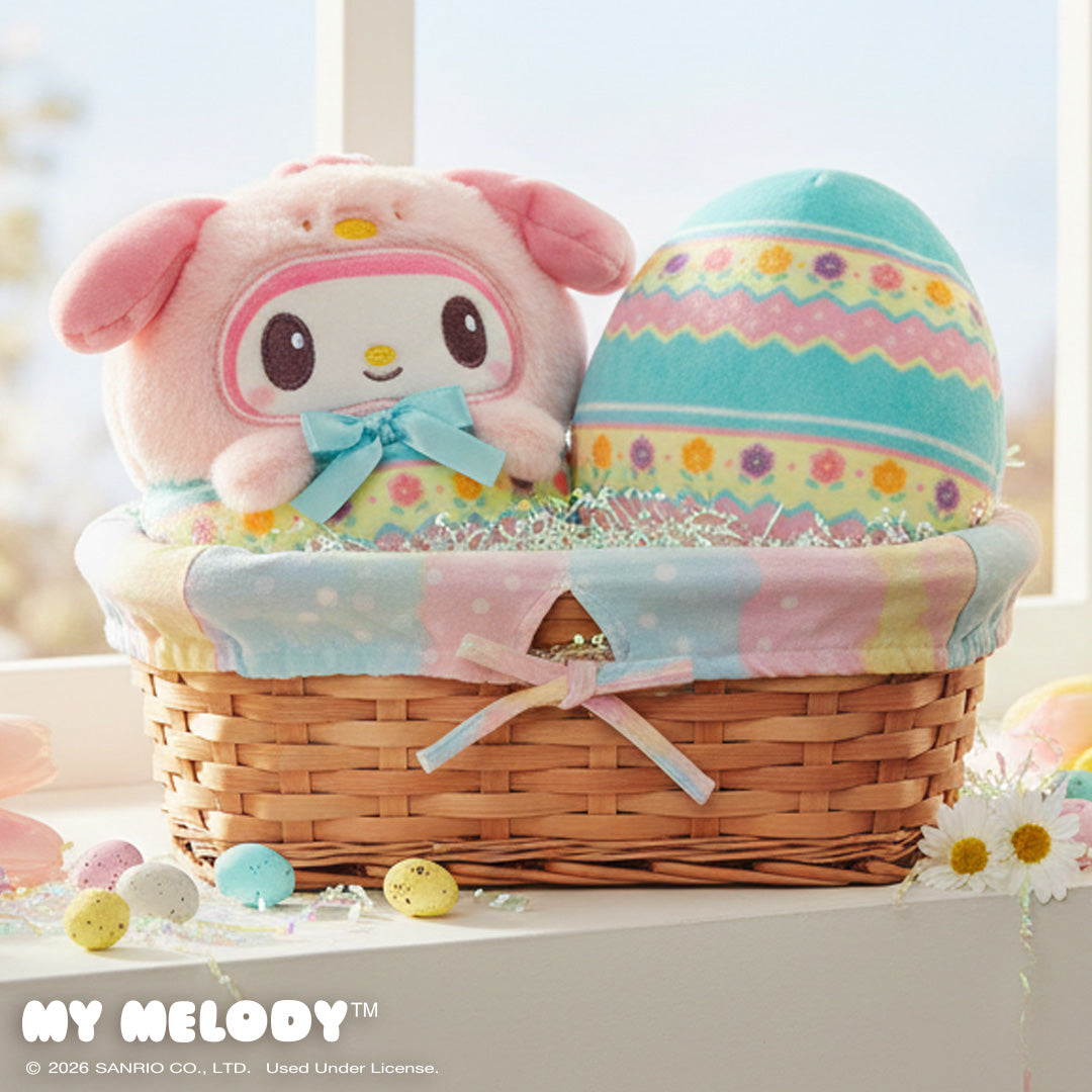 Easter Egg My Melody 4" Reversible Plushie in an Easter basket in a windowsill surrounded by flowers and chocolate eggs