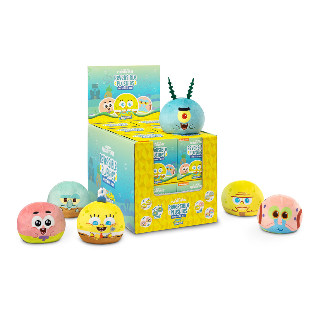 Six plush toys are displayed in front of an open box labeled "Plushiverse SpongeBob Reversible Plushie Mystery Box." The box features images of the plush toys and text about their reversible feature, adding a delightful twist often found with plushie blind boxes.