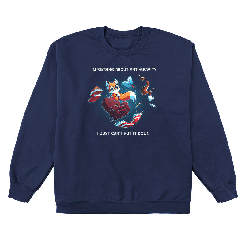 Crew Neck Sweatshirt_TeeTurtle navy blue Anti-Gravity Enthusiast apparel featuring a fox wearing glasses reading a book with floating in mid-air with its living room furniture, such as a chair, rug, and lamp, with the caption, “I’m Reading About Anti-Gravity, I Just Can’t Put It Down“.