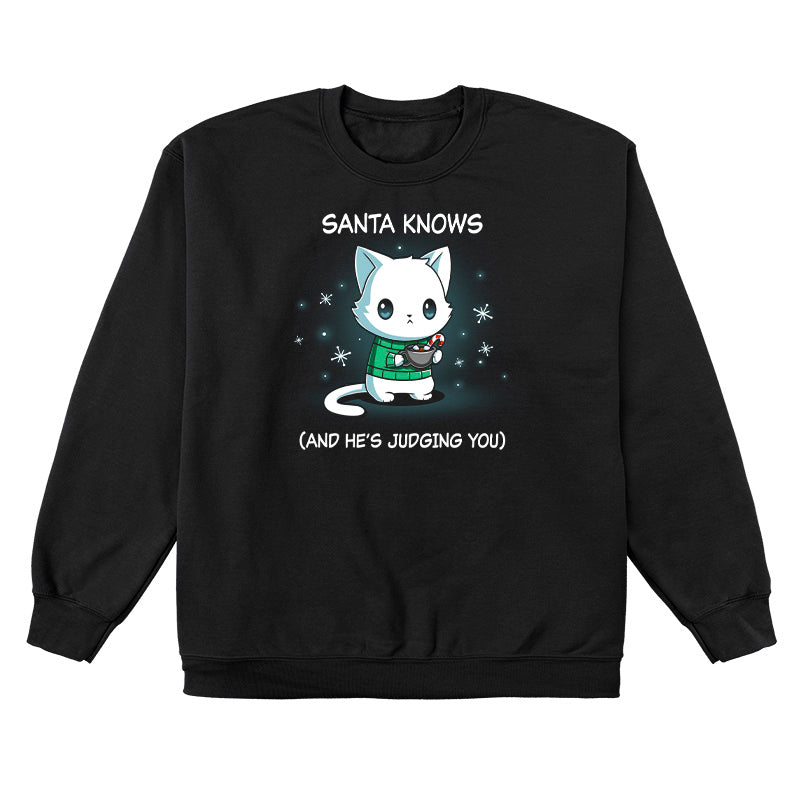 Crew Neck Sweatshirt_TeeTurtle black Santa Knows apparel featuring a cat with a deadpan expression holding mug with hot chocolate, marshmallows, and a candy cane surrounded by snowflakes, with the caption, “Santa Knows (And He’s Judging You)“.