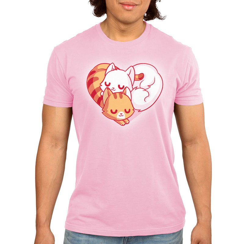 A man wearing a pink t-shirt with a TeeTurtle Cuddling Kitties on it, the perfect cuddle buddy for cuddling kitties.