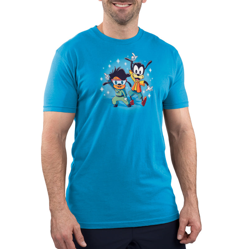 A young man wearing a blue Disney T-shirt with A Goofy Movie characters.