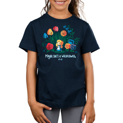 A young girl wearing an Officially Licensed navy t-shirt with Disney's Maybe She's A Wildflower flowers on it.