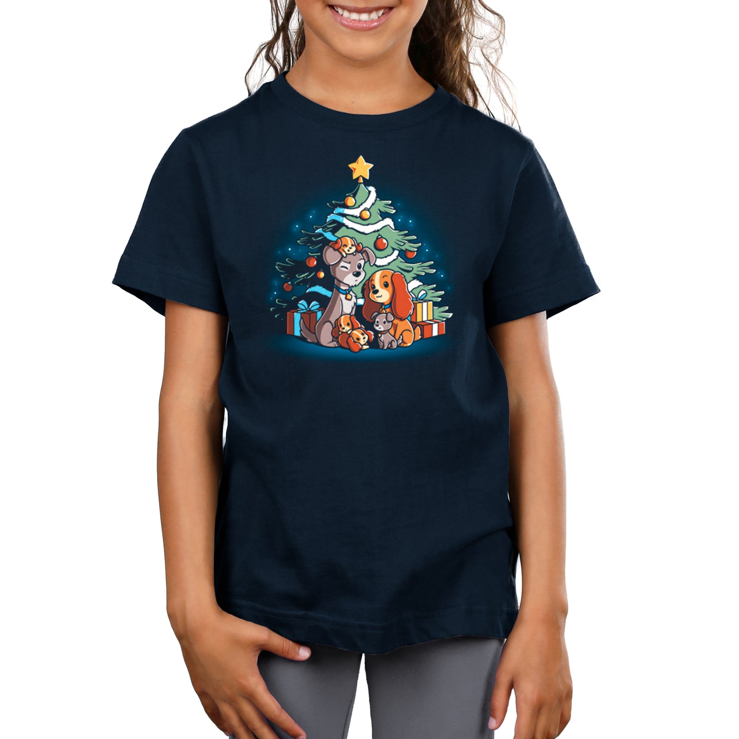 A girl wearing a navy blue t-shirt with a Christmas tree - Merry Christmas From Lady and the Tramp Disney t-shirt.