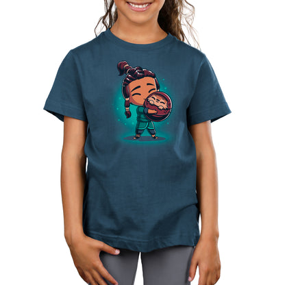 A girl wearing a Disney Super Soft unisex T-shirt with an image of BFFs (Raya and Tuk Tuk) holding a ball.