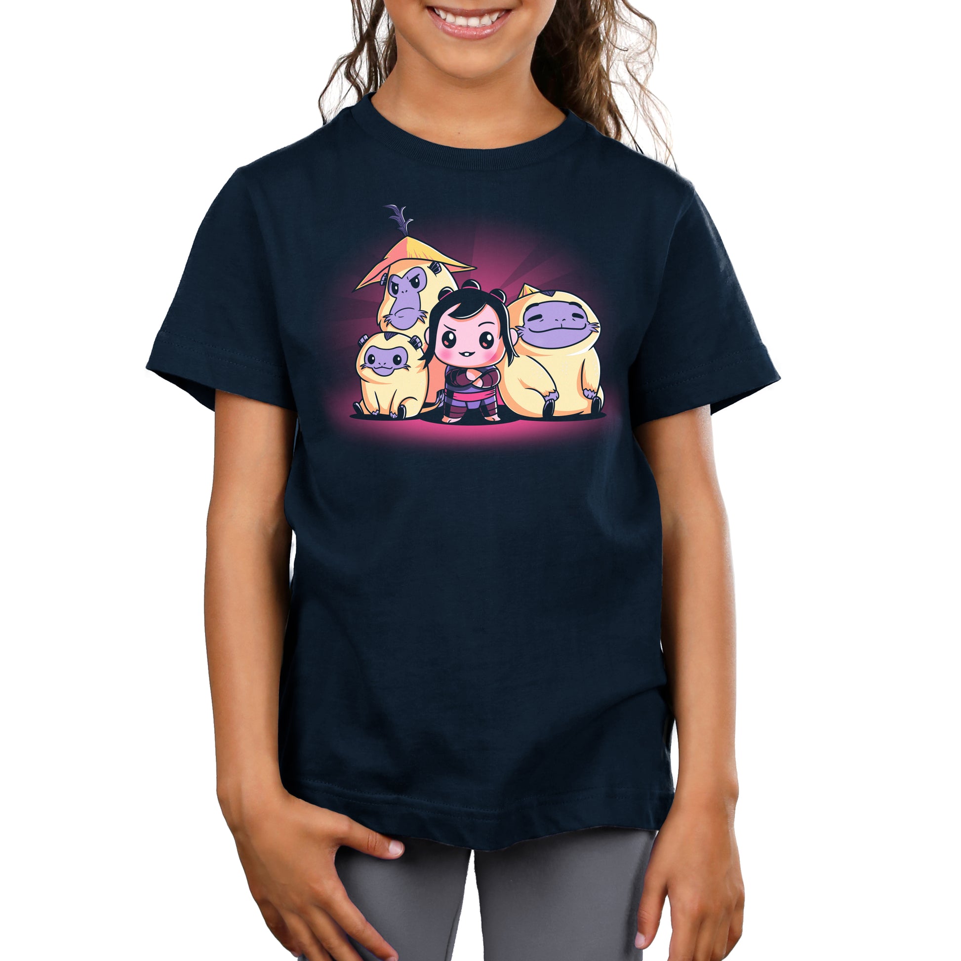 A girl wearing an officially licensed Disney T-shirt featuring the cartoon character Baby Noi from Raya and the Last Dragon.