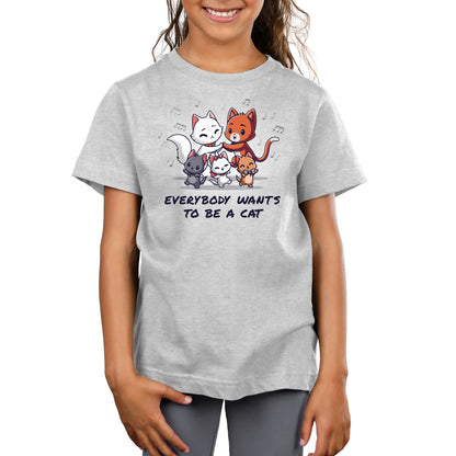 A young girl wearing an officially licensed Disney "Everybody Wants to Be a Cat" T-shirt.