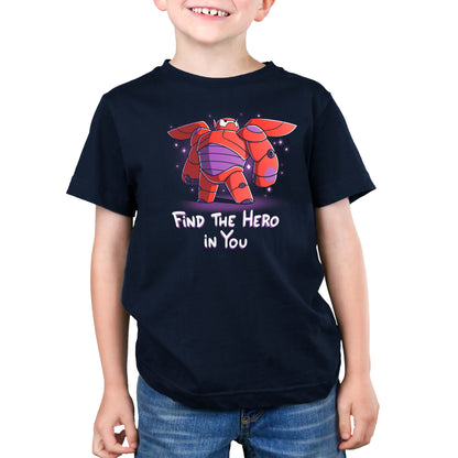 A boy wearing a Disney Find the Hero in You T-shirt.