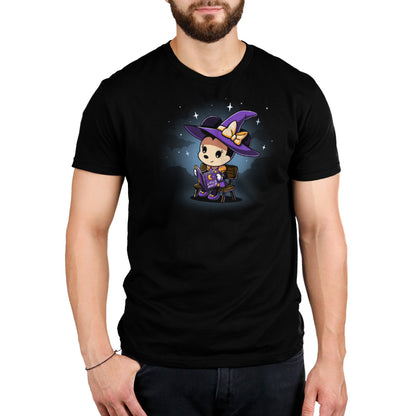 A Minnie's Spellbook officially licensed black t-shirt with an image of a witch wearing a hat. (Brand: Disney)