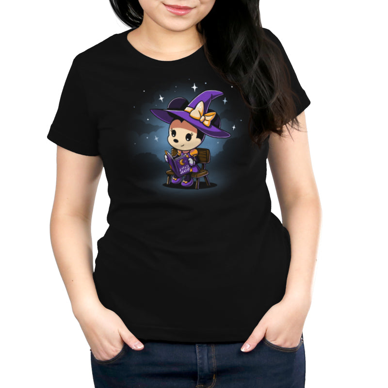 An officially licensed Disney women's black t-shirt featuring an image of a witch, called Minnie's Spellbook.