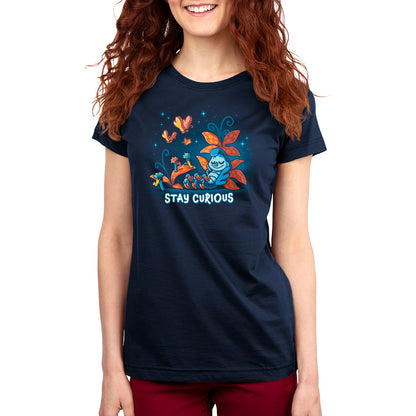 A woman wearing an officially licensed Disney "Stay Curious" Alice in Wonderland t-shirt.