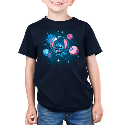 A young boy wearing a Disney T-shirt featuring Stitch in Space from Lilo and Stitch.