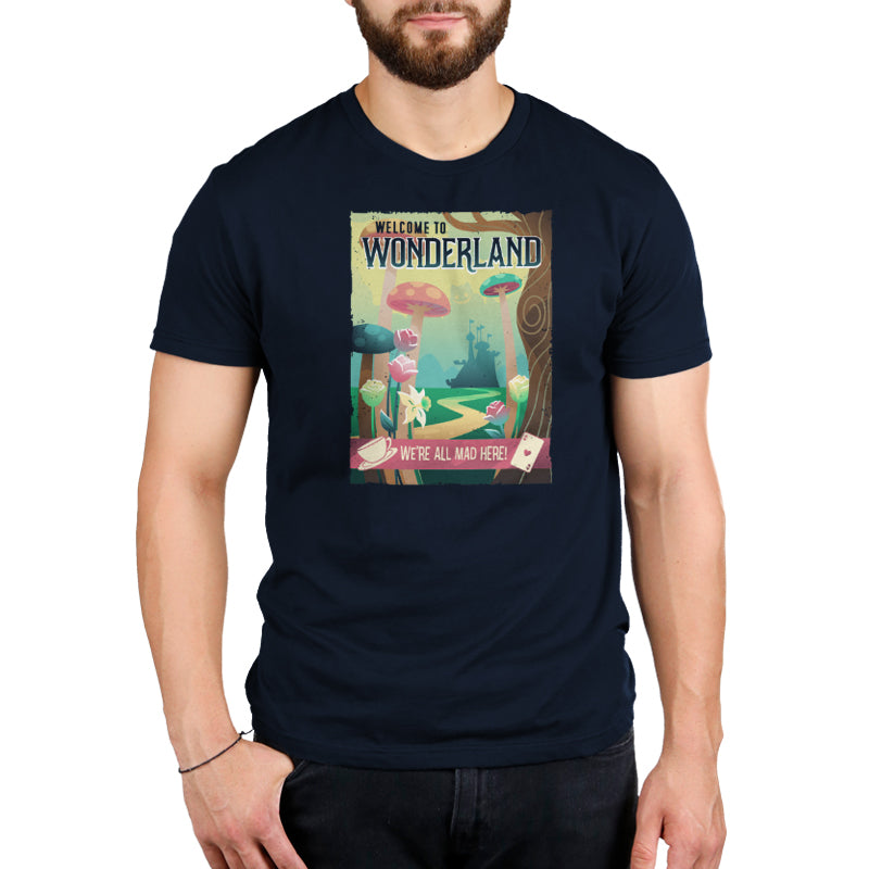A man wearing a Disney "Wonderland Travel Poster" t-shirt.