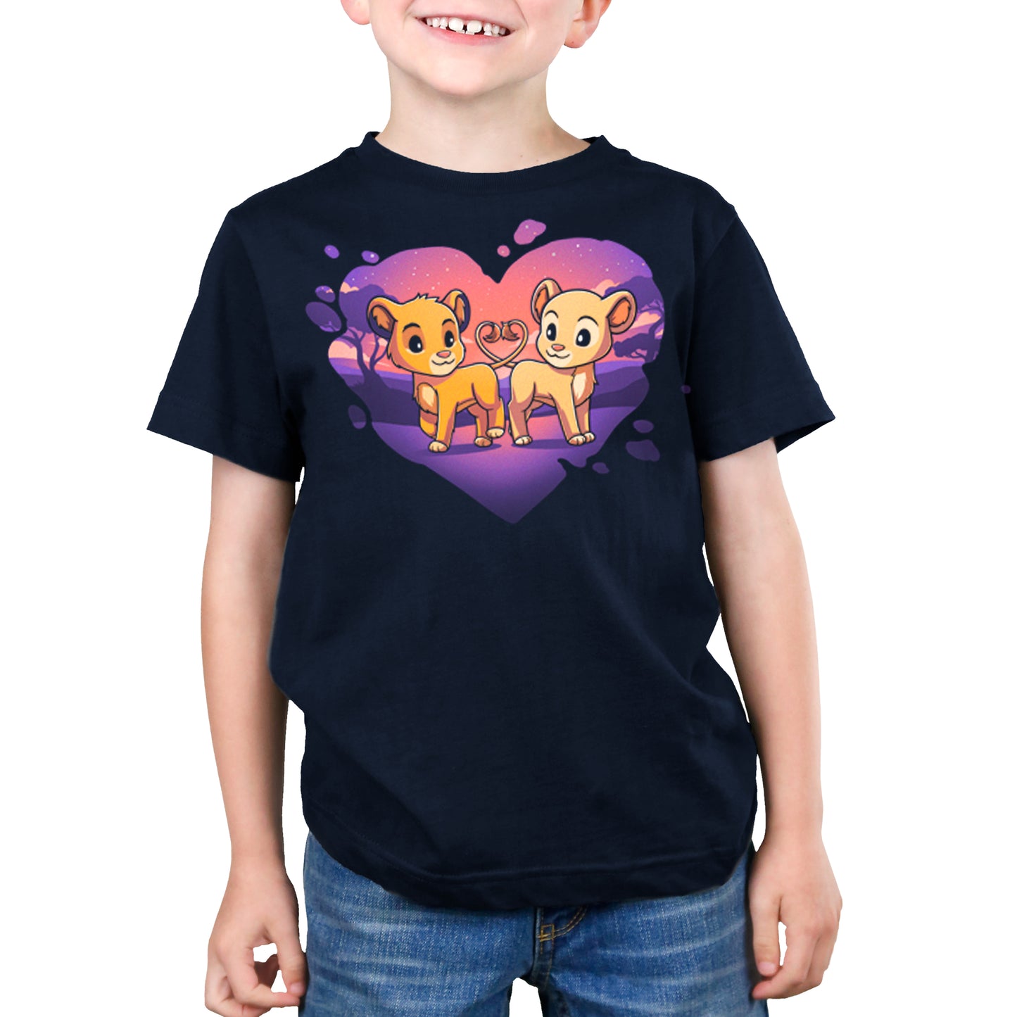 A young boy wearing a Disney Lion King t-shirt with two lion cubs named Simba and Nala in a heart.