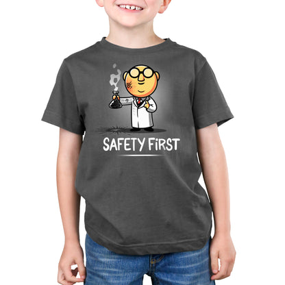 A young boy wearing a Muppets: Dr. Bunsen Honeydew: Safety First T-shirt.